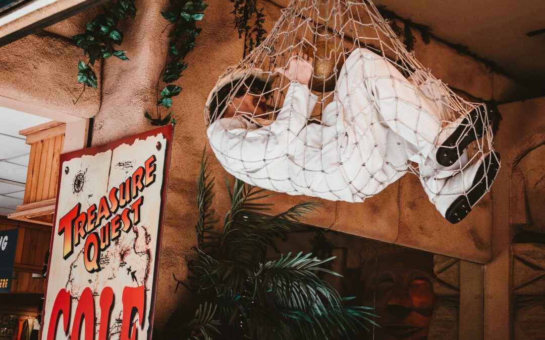 a man in a white suit hanging from a net