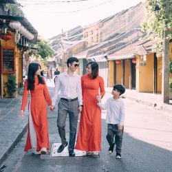 a group of people walking down a street